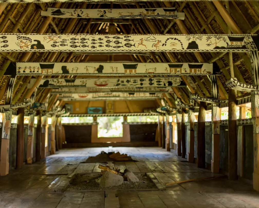 Colorful inside with traditional painting on rafters of a Bai, a traditional men's house in Palau