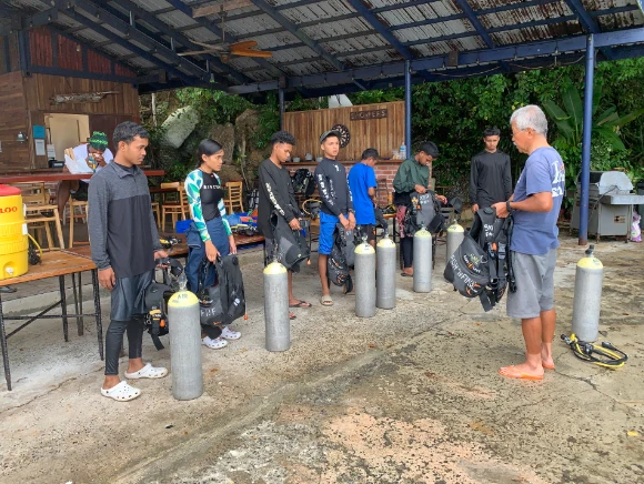 Children learning scuba diving in Palau