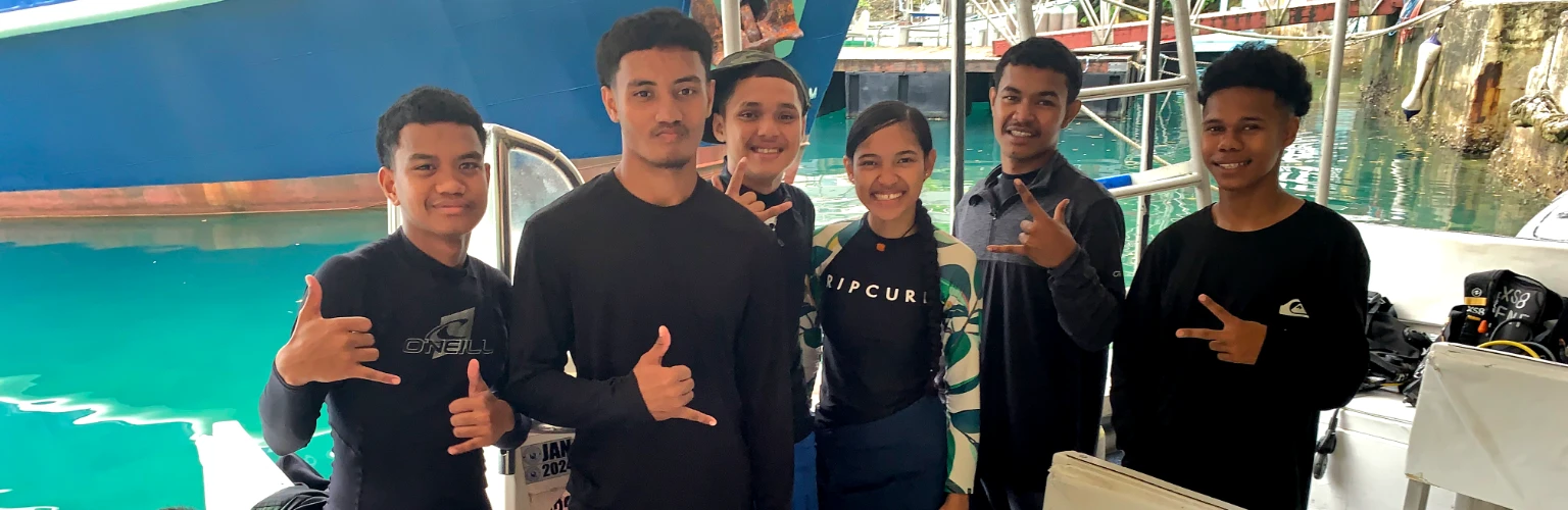 Children learning scuba diving in Palau