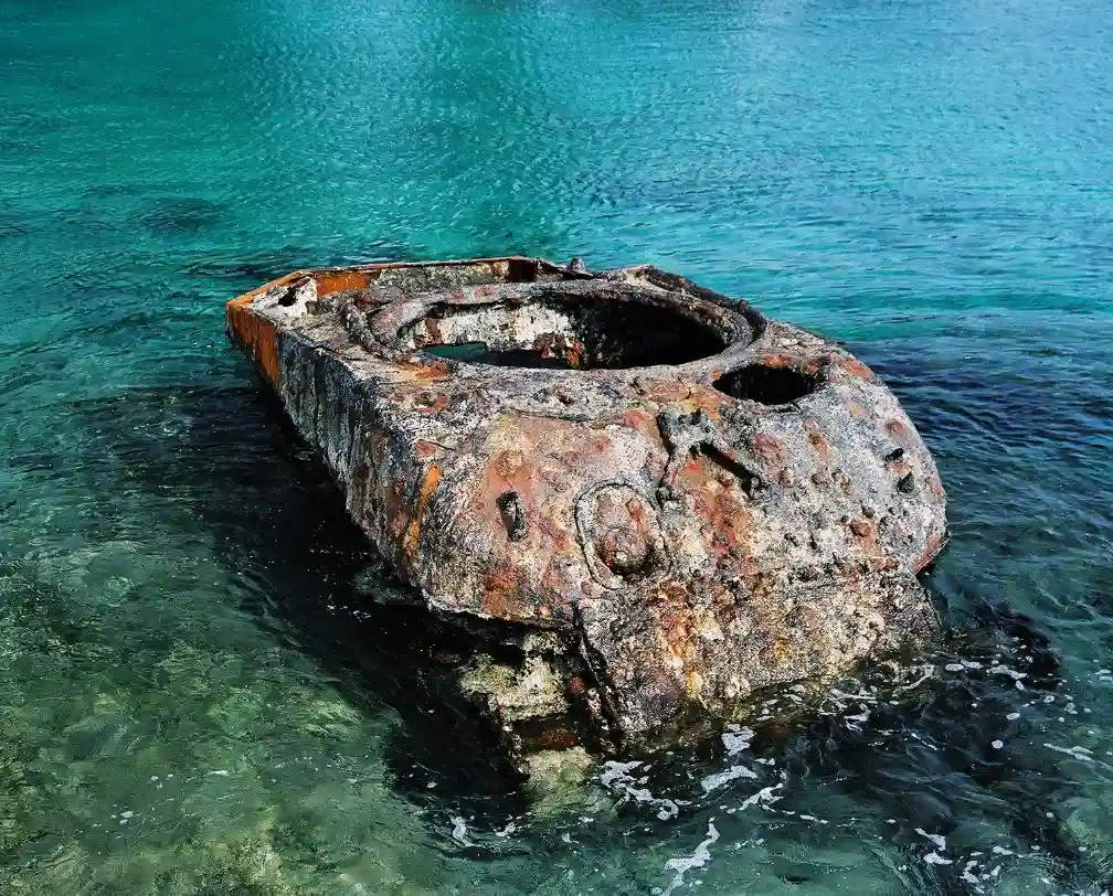 WW2 relict on the beach in Peleliu Palau, half in the ocean and half out.