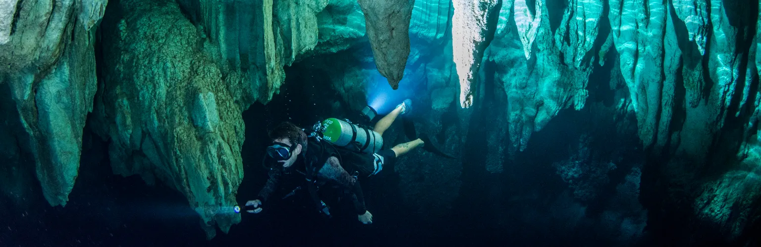 underwater photo of a scuba diver in Chandelier Cave a dive site in Palau